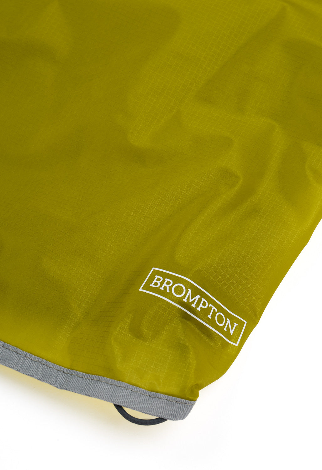 and wander x Brompton Sil Poncho - Yellow Green